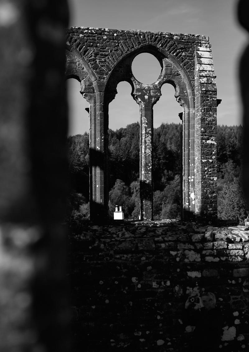 A Gothic window arch with main features intact but smaller details eroded